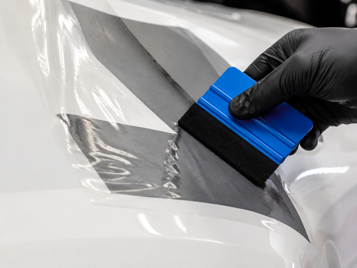 Applying a vinyl decal with a squeegee