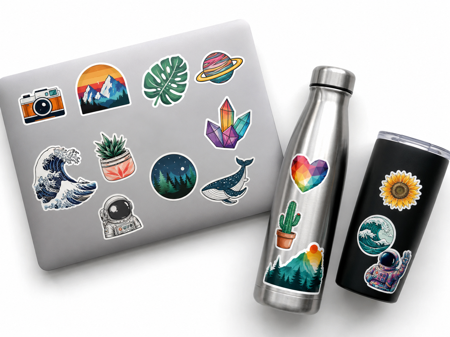 Custom vinyl stickers on a laptop, water bottle and tumbler