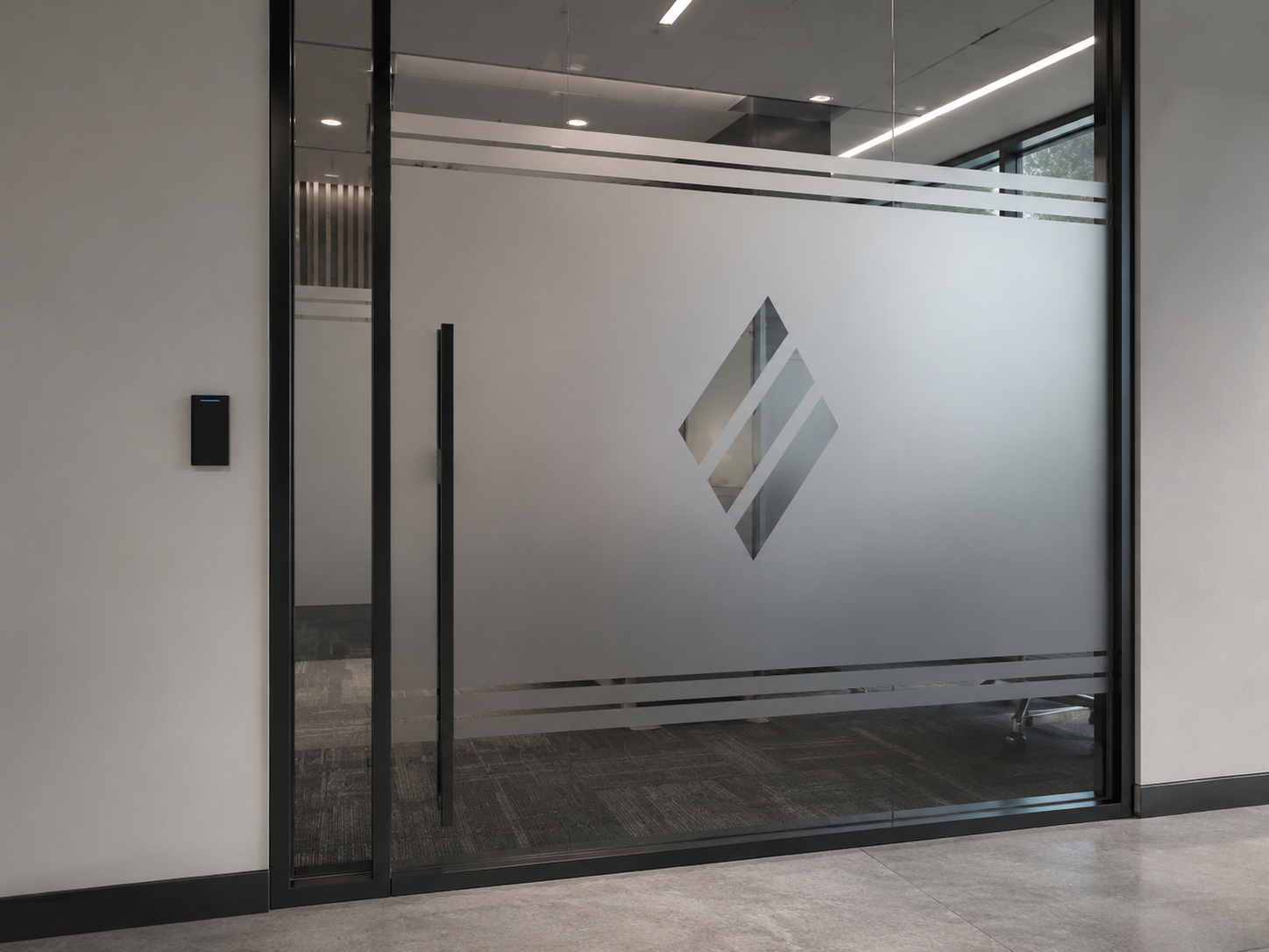 Frosted vinyl privacy film with a logo on a glass office door